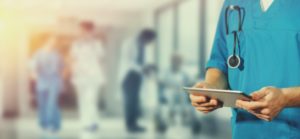 Hospital working working on tablet computer